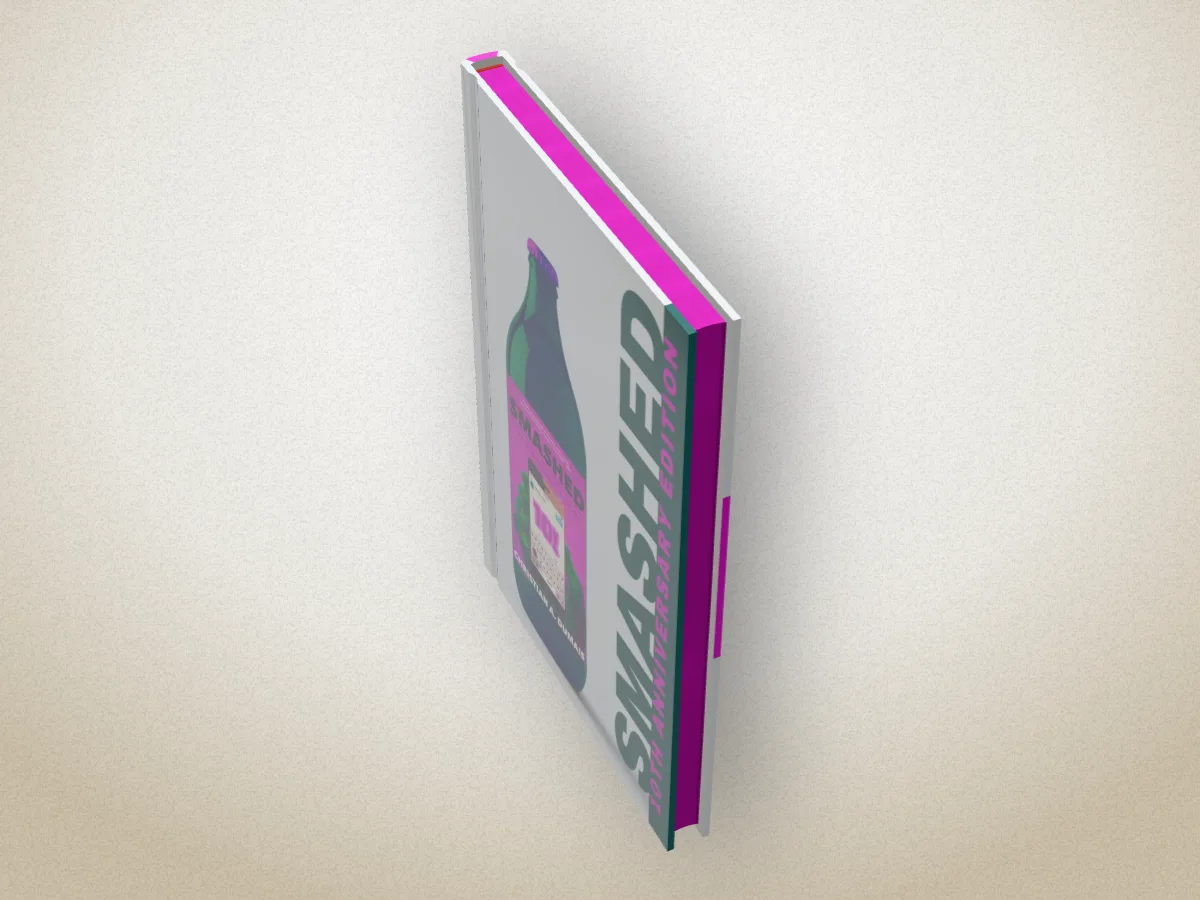 Smashed by Christian A. Dumais as a hardback seen from above, its page edges sprayed magenta along the top and the side