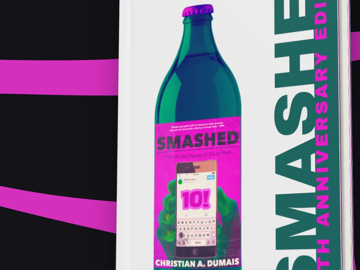 A close crop of Smashed in a glossy dust jacket, running off the edge of the picture, on a black and magenta flowing pattern