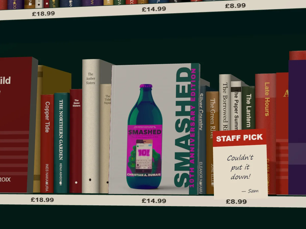 Smashed by Christian A. Dumais face out in a green bookshop bay, price strips on the shelf and a handwritten staff pick beside it